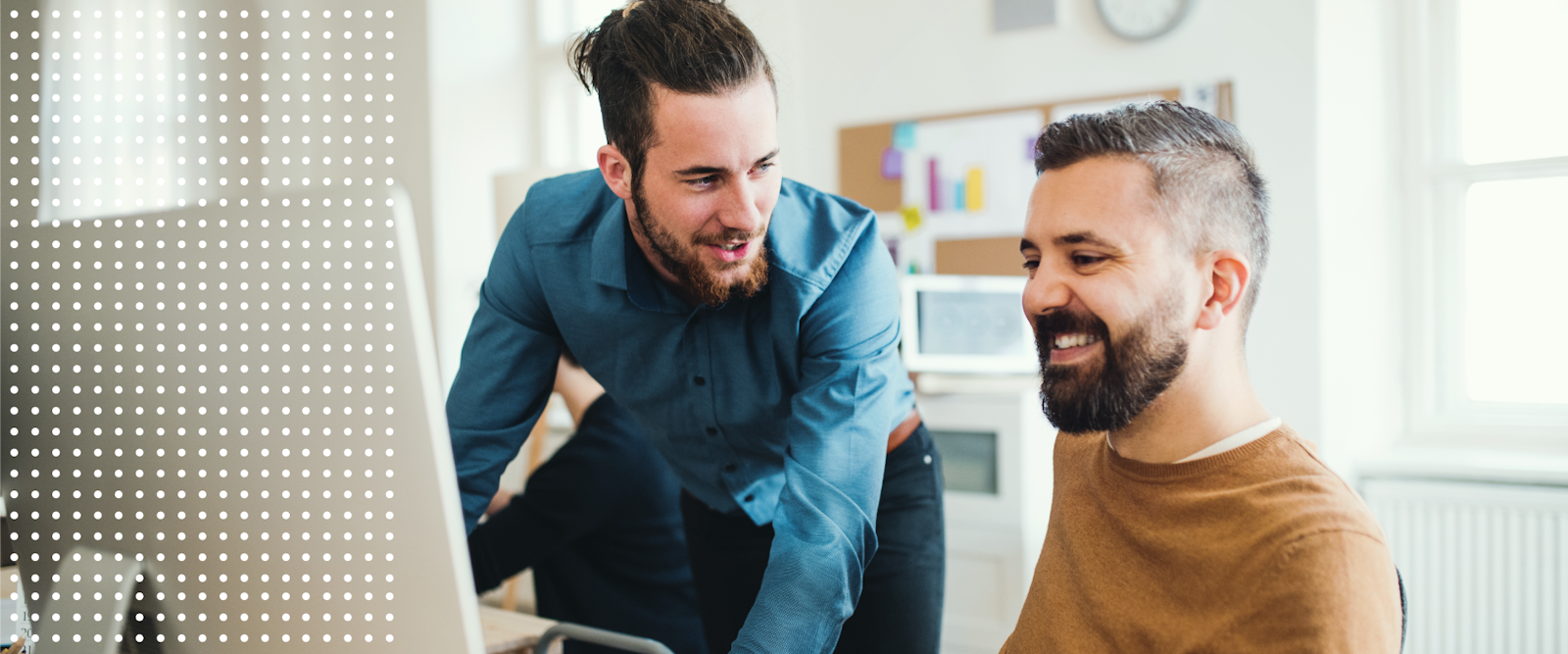 The Foxtrot Marketing Group brand design photo of two guys looking at screen.