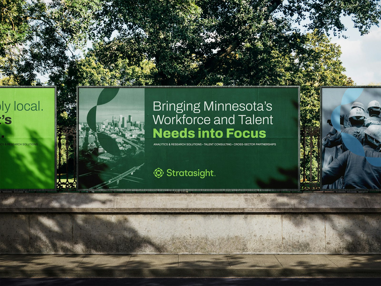 Stratasight billboard: The Stratasight brand identity, developed by Capsule in Stratasight's 2026 rebrand, displayed on a pedestrian billboard. Text reads: "Bringing Minnesota's Workforce and Talent Needs into Focus".