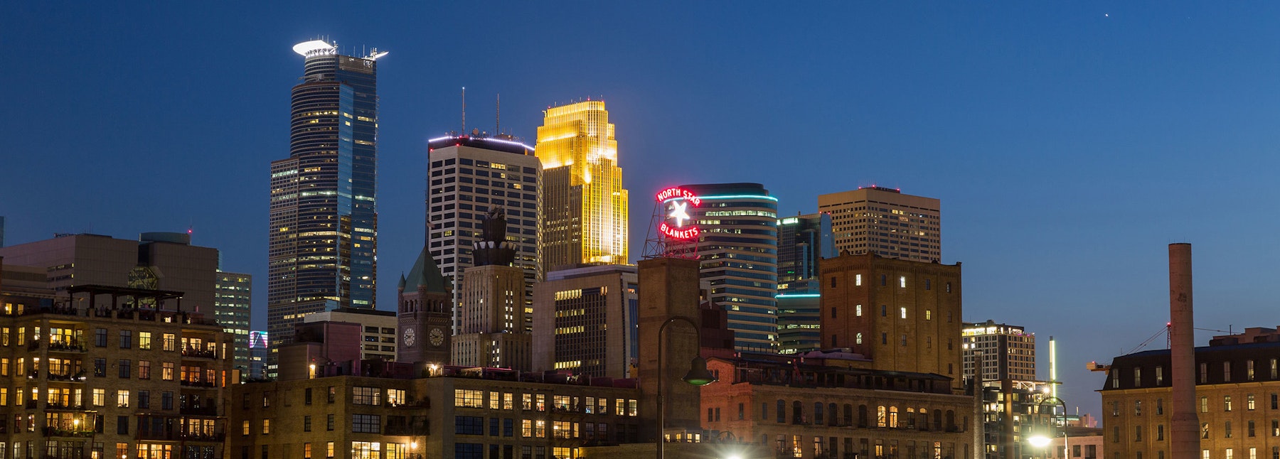 The Minneapolis Downtown Council brand logo design photo of Minneapolis skyline.