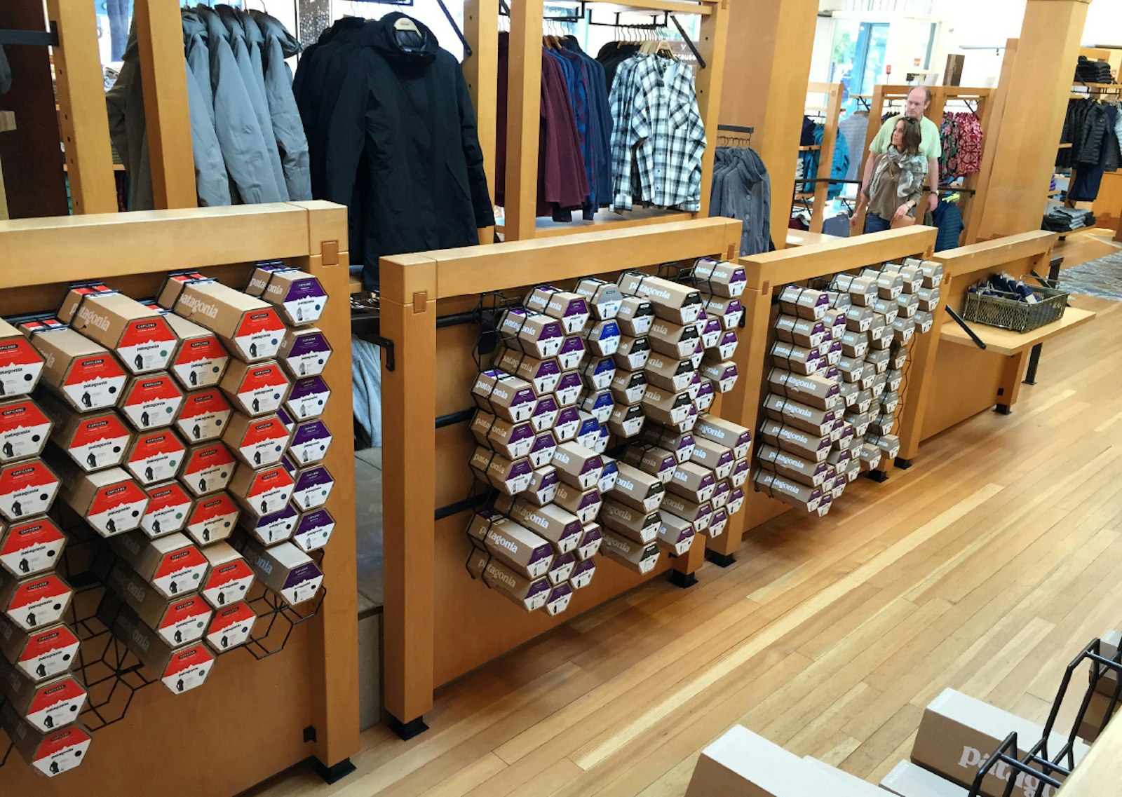 The Patagonia brand packaging design retail display in store with wood floors.