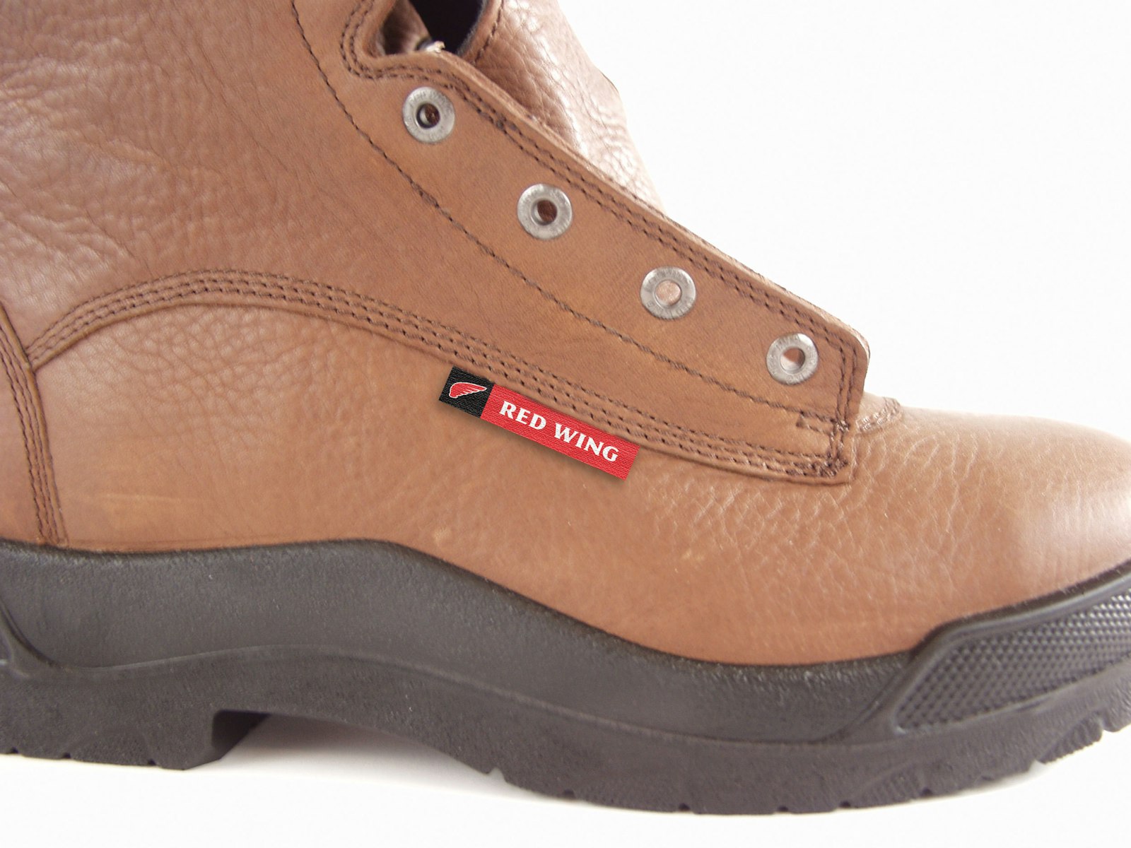 The Red Wing Shoes brand design logo on a boot tag.
