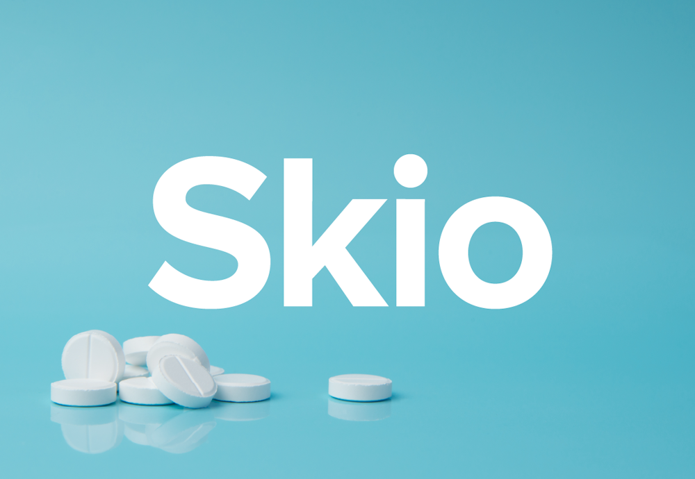 The Skio name designed on a blue background with pills scattered.