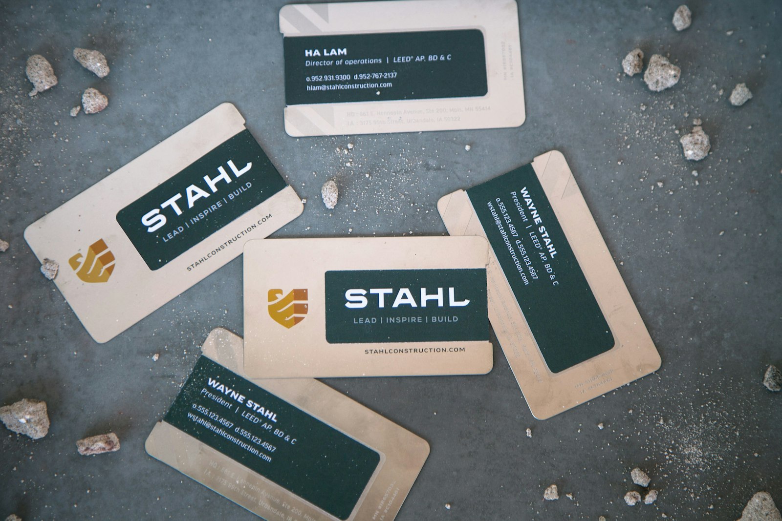 The Stahl Construction brand logo design on business cards in random pattern.