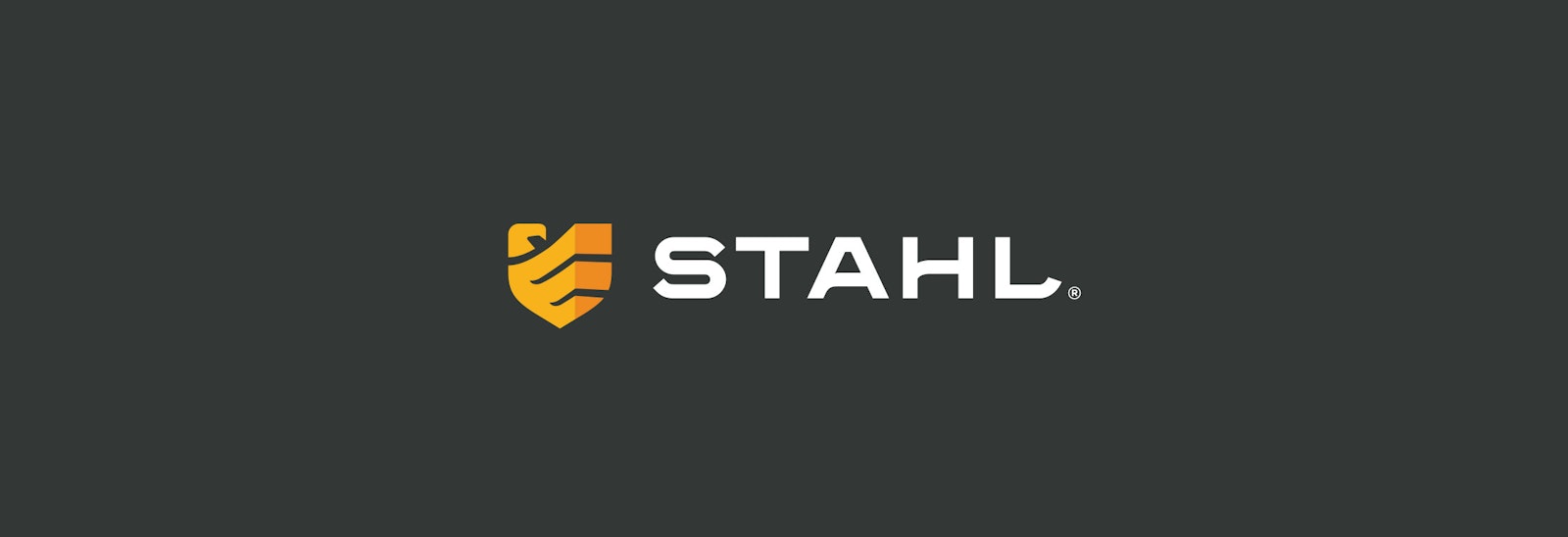 The Stahl Construction brand logo design horizontal of orange shield on black background.
