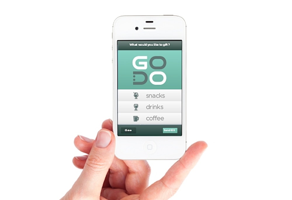 Mobile phone with a GoDo branded app screen.