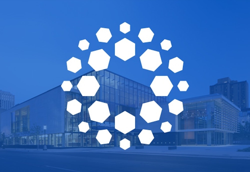 Minnesota Orchestra's designed logo in white on a blue backdrop with orchestra hall.