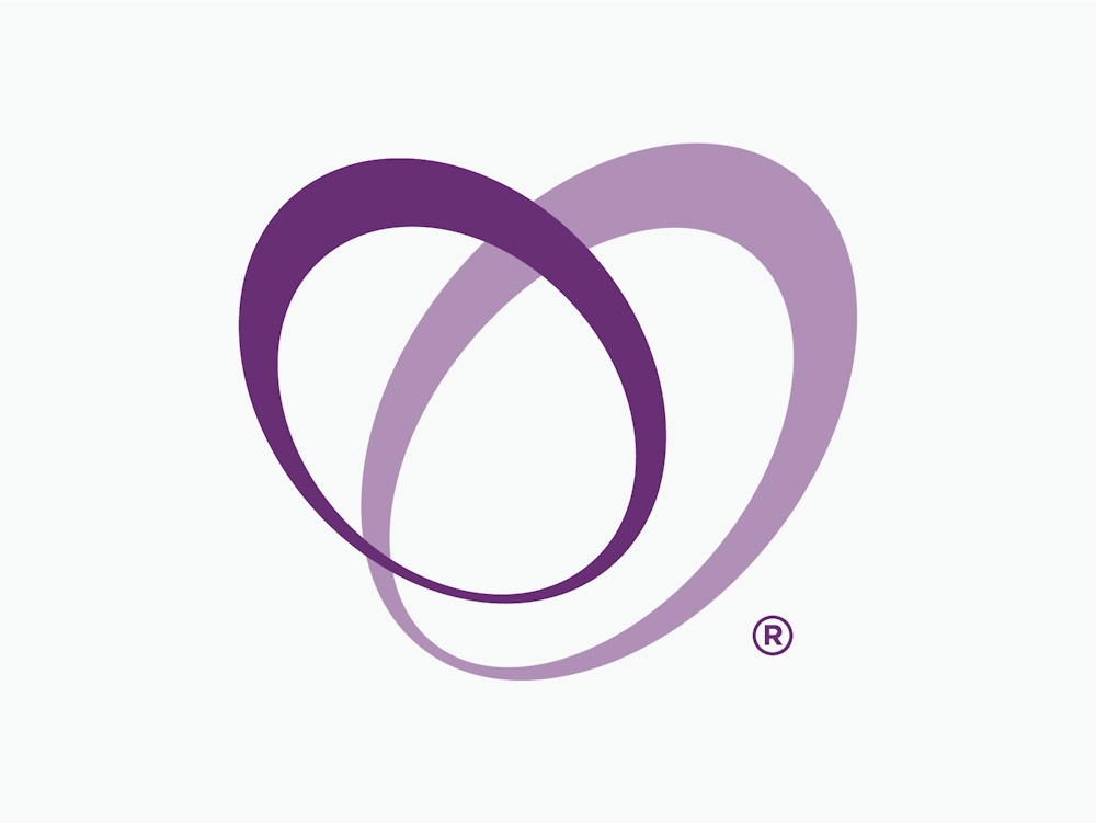 Touching Hearts at Home brand design logo two overlapping ovals in purple.
